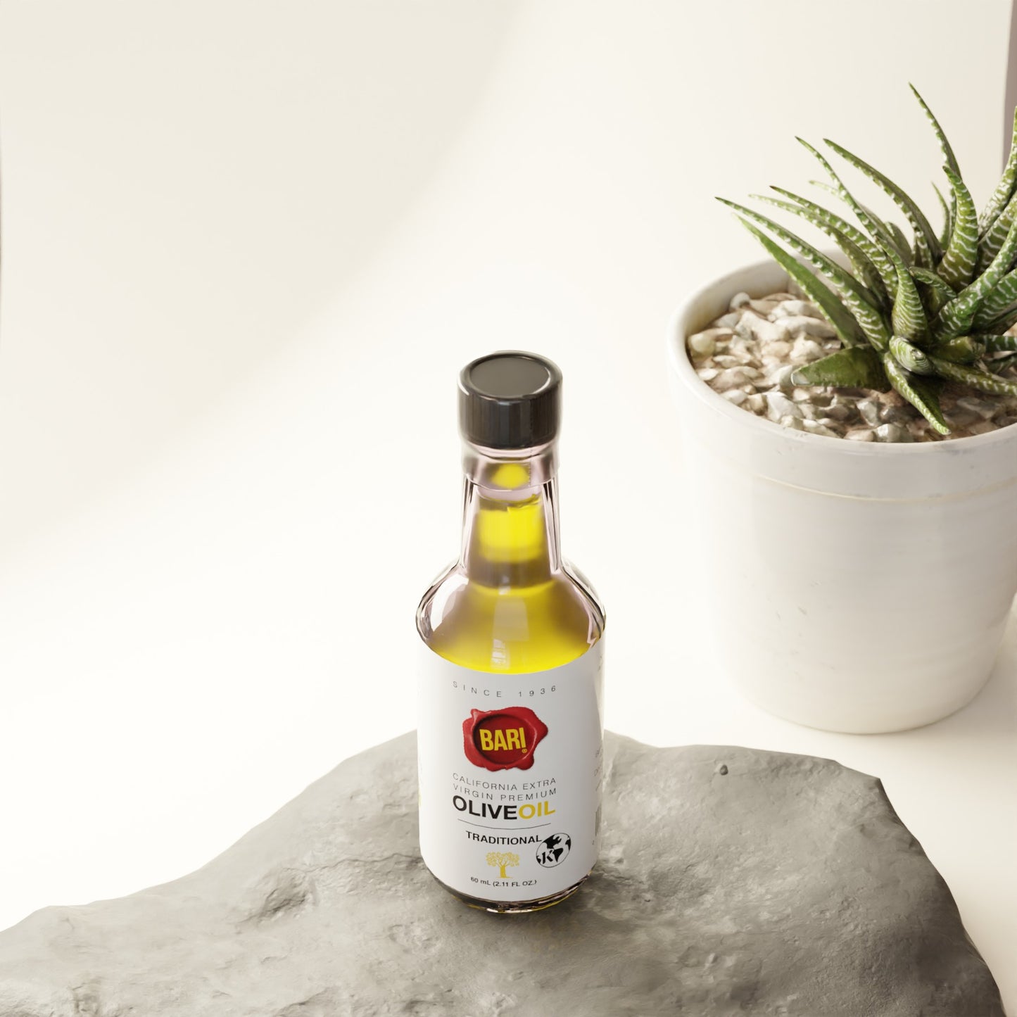 Bari 60mL Traditional bottle of olive oil sitting on a rock near a potted plant
